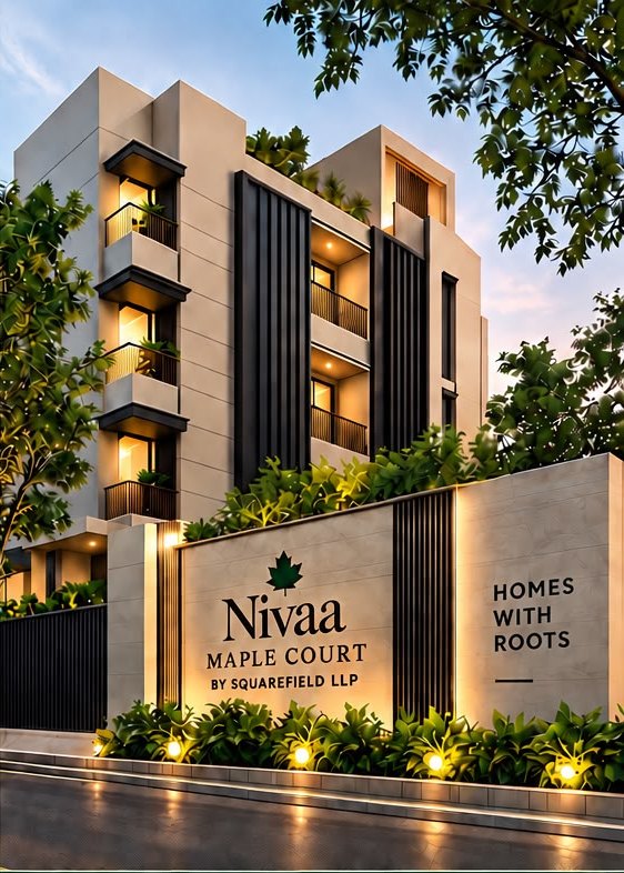 Nivaa Maple Court at dusk: the entrance wall and the building behind it